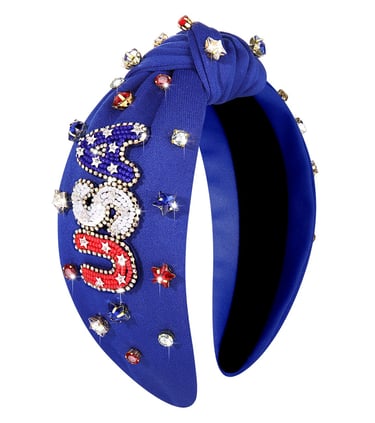 Blue knotted headband with USA beaded lettering and sparkling star jewels for 4th of July.