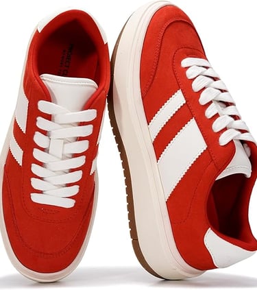 Red suede sneakers with white stripes and platform soles for women.