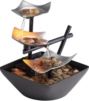 Indoor tabletop water fountain with cascading water, natural river rocks and LED lights for calming home or office decor