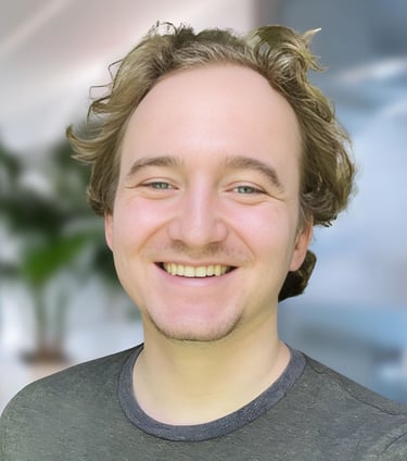 a man with a beard and a beard smiling