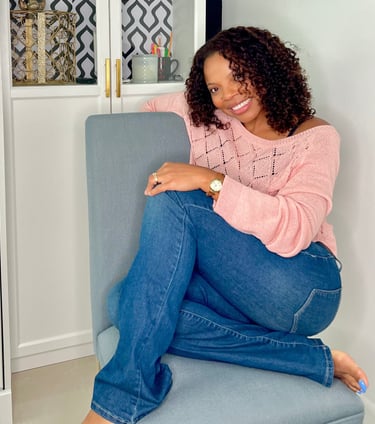 a woman sitting on a chair in a room