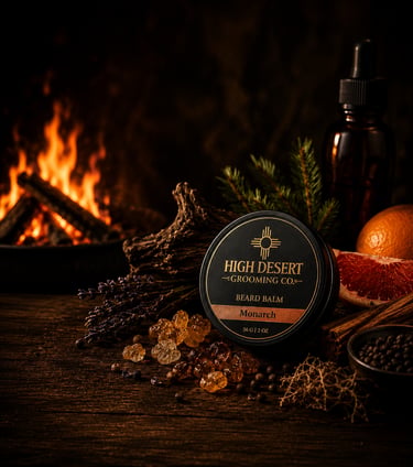 Monarch beard balm tin by High Desert Grooming Co with natural resin and fireplace background.