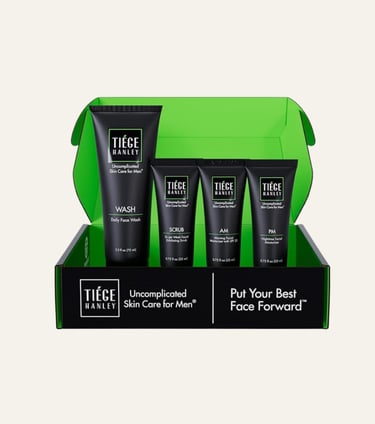 Tiege Hanley men's skin care system featuring face wash, scrub, and moisturizers in a green box.