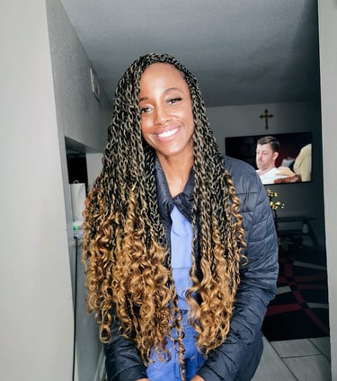 a woman with a long passion twist hairstyle