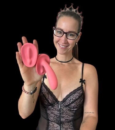Pleasurelit Patricia holding the arosum vibrators for a review