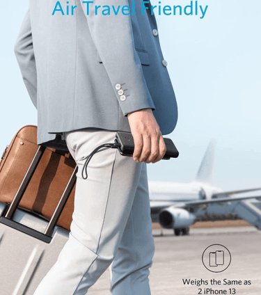 Traveler using a portable travel Anker PowerCore charger