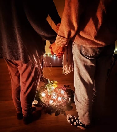Women holding hands at Silvia's Women Circle