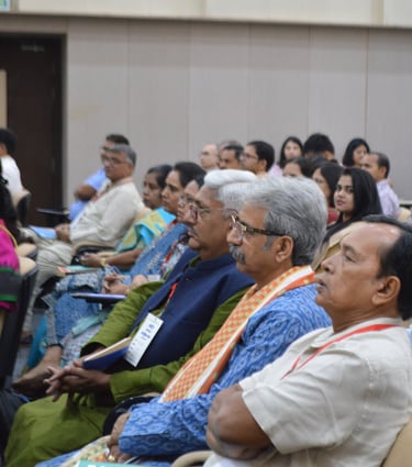 a group of people sitting in chairs in a room