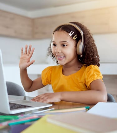 a young girl with headphones and a laptop waving hand