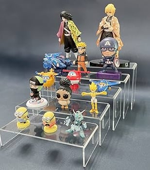 Clear acrylic risers showcasing assorted anime figures in a tiered display arrangement.