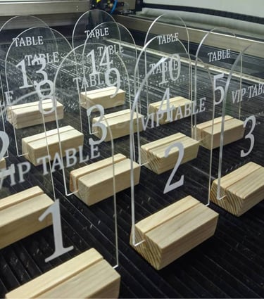 Array of clear Acrylic Table Numbers with bold black script for tables 1 through 5 and VIP precision