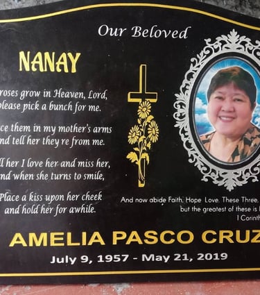 Engraved granite memorial stone with photo and golden accents for Amelia.