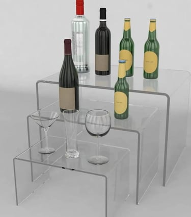 Acrylic risers elegantly presenting wines and glasses, perfect for showcasing and tastings.
