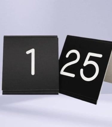 black Acrylic Table Tent with a number 1 -25 with white fonts