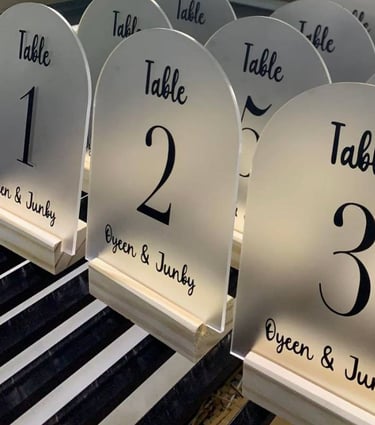 Array of clear Acrylic Table Numbers with bold black script for tables 1 to 5 and VIP precision cut