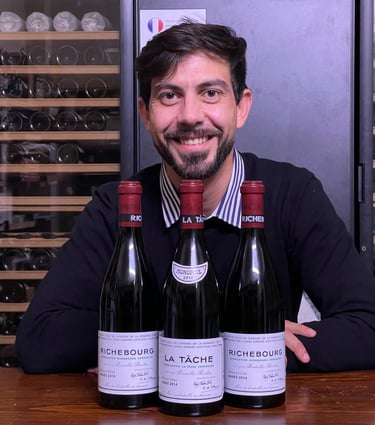 a man in a sweater and sweater with a wine bottle