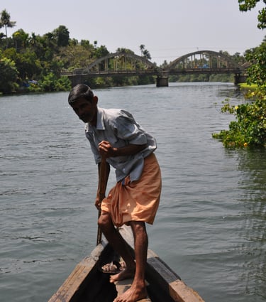 guide punting boat in Kochi, Kerala, India