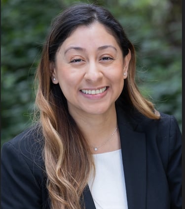 a woman in a black suit and white shirt