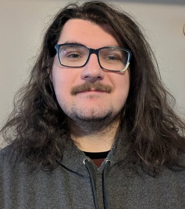 Headshot of J Brenkus