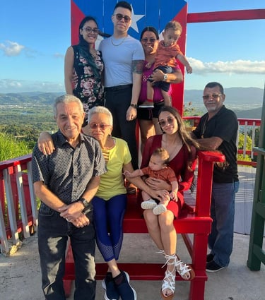 a family in a big decorative puerto rico shair