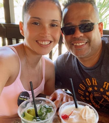 a man and a woman with tipical drinks in puerto rico