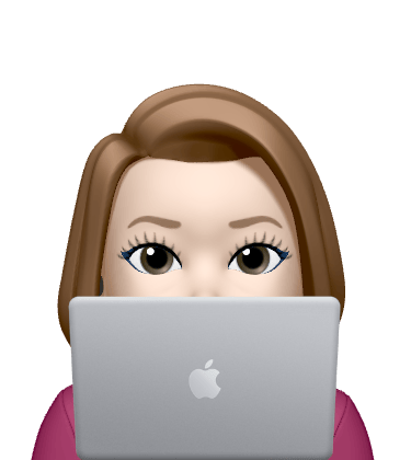 a woman with a laptop computer sitting in front of a laptop