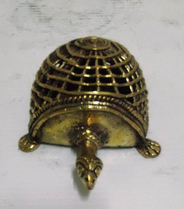 "Handcrafted brass tortoise with mesh-style carving on back–top view-for global shipment"