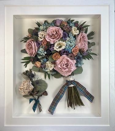 a side view preserved wedding bouquet with a tartan ribbon and buttonhole