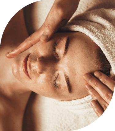 woman receiving facial massage