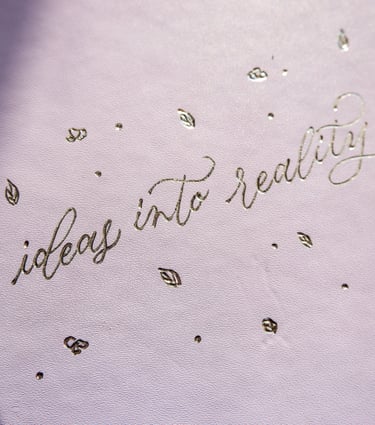 A leather journal customized with hot foiling by NYC calligrapher Handwritten by Belle.