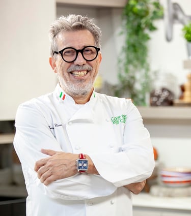 a man in a white shirt and glasses is smiling