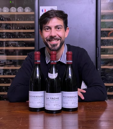 a man in a sweater and sweater with a wine bottle