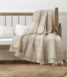 camel and beige plaid blanket throw on bench