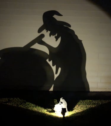 shadow of a witch stirring a cauldron