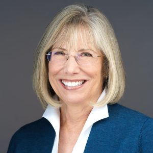 a woman in a blue jacket