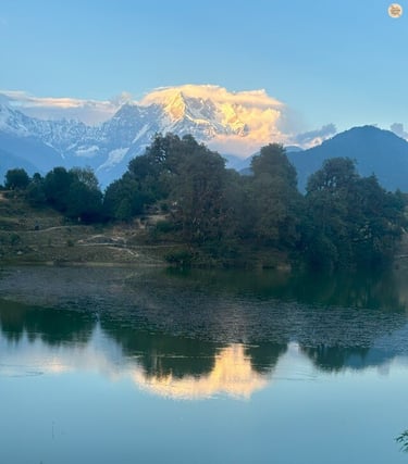 Deoria Tal reflecting Chaukhamba and Himalayan peaks, Uttarakhand, serene alpine lake.
