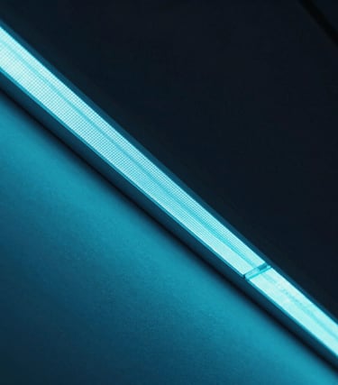 Sleek close-up of a commercial LED display bezel, showing sharp pixel density and cool cyan glow, high-contrast architectural framing