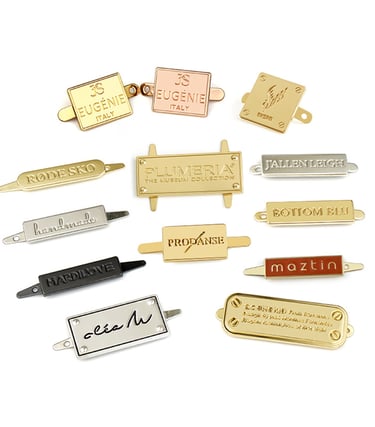 Elegant and polished branded metal hardware for premium custom bags, made by King Fly.