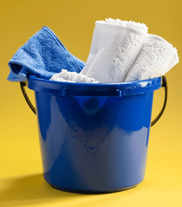 a bucket of towels and towels in a bucket