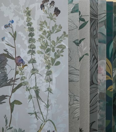 Variety of botanical and textured wallpaper samples featuring floral patterns and marble designs.