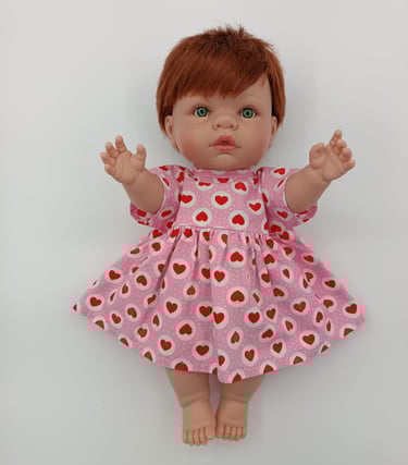 Lille Love doll dressed in pink heart dress made for Minikane doll