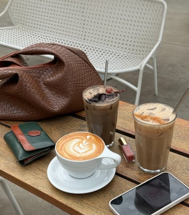 a table with a phone and a purse