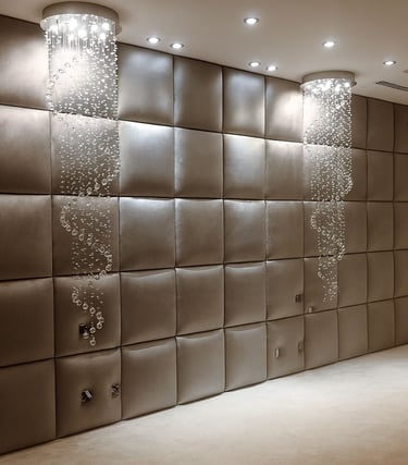 Custom upholstered home theater wall panels with padded square design by Solo Home Decor