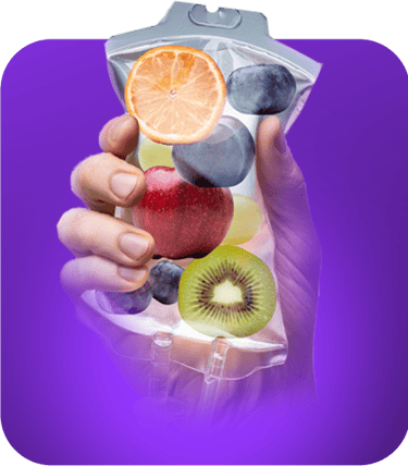 a person holding a bag of fruit on a purple background