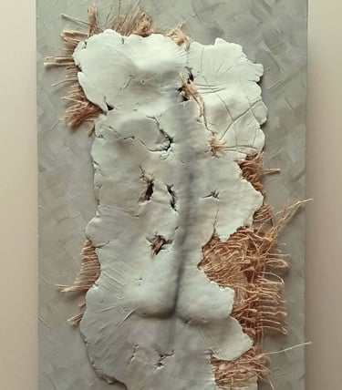 A relief sculpture of a fragmented female (rear view) with protruding hessian, painted cool browns