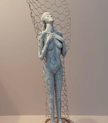 A standing female figure, leaning back with eyes closed, surrounded by a wire netting enclosure