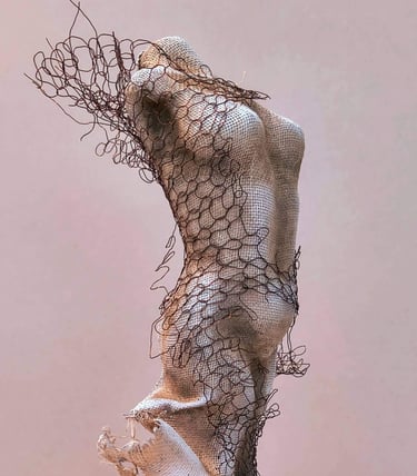Close up of a female torso, clothed in tight fitting fabric, wrapped in torn copper wire netting
