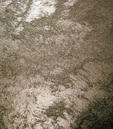 A warm silver paint sample showing its lustre and beautiful grainy texture.
