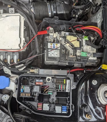 a car engine with a lot of wires and wires