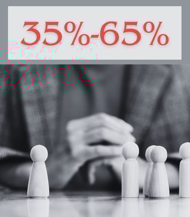 a person standing in front of a number of wooden toy people